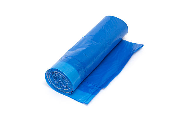istock Roll of blue plastic garbage bags isolated on white 509795190