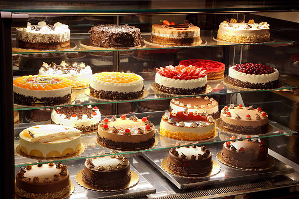 istock Different types of cakes in pastry shop glass display 509795378