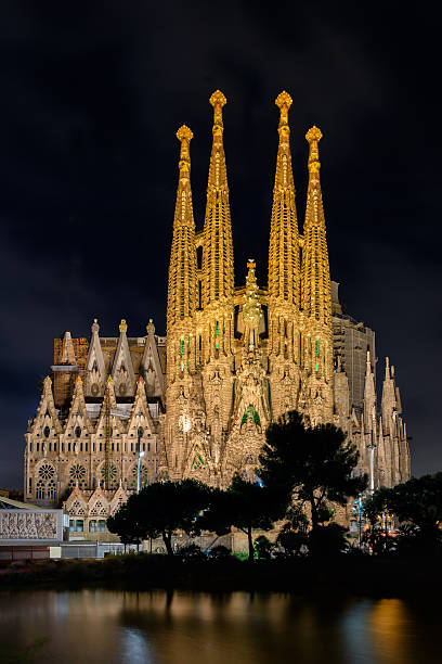 Night view of Nativity facade of Sagrada Familia cathedral in Barcelona stock photo