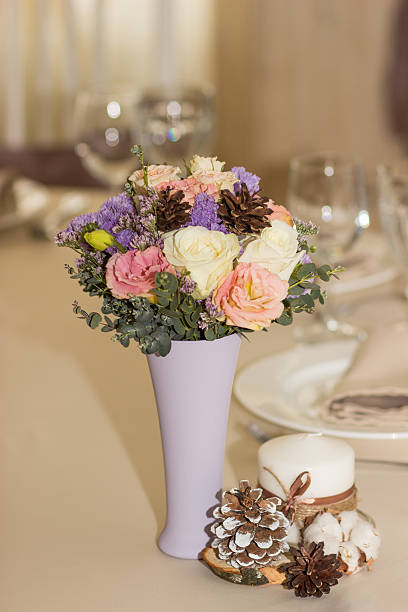 istock Flowers in violet vase on wedding table 509796906