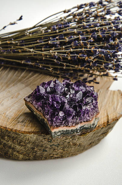 istock Raw amethyst rock with bunch of aromatic lavender flowers on 509797700