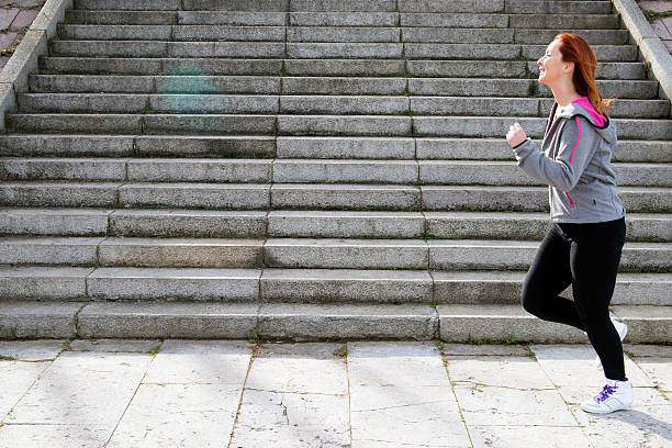 istock Runner woman running on stairs 509798454