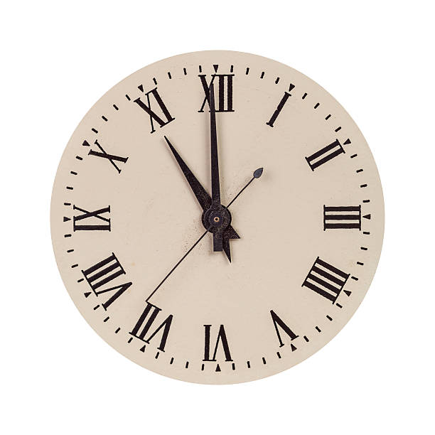 Vintage clock face showing eleven o'clock stock photo