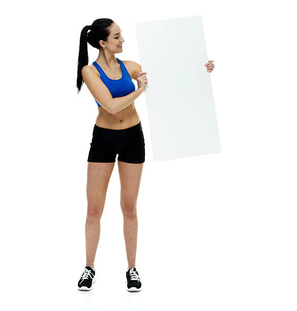 istock Smiling female athlete holding placard 509800808