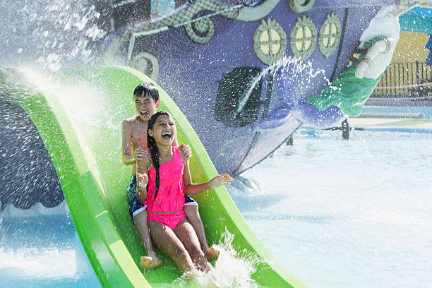 istock Children on water slide 509801345