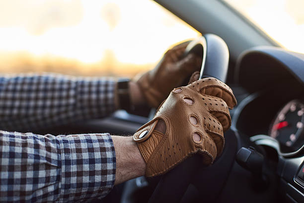 istock Young professional driver in car with hands on steering wheel 509801386