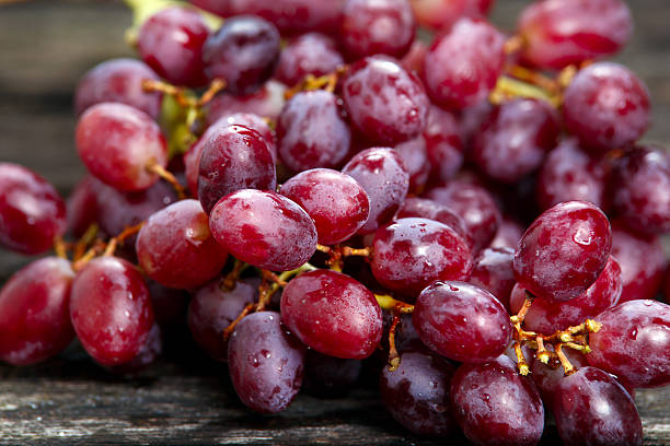 istock Red grape with water drops, close up background. selected focus 509803418