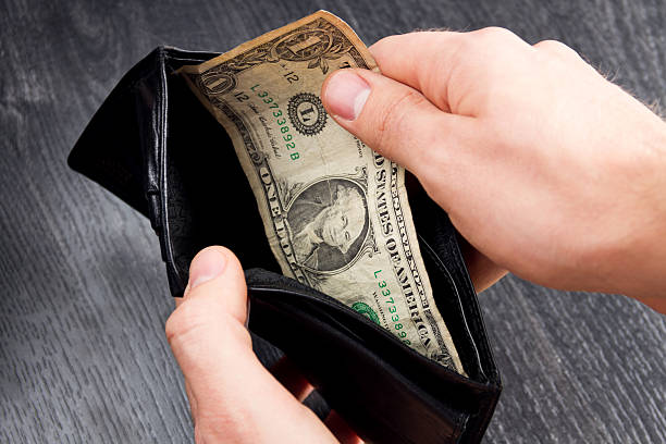 istock Black leather wallet with one dollar. Concept: poverty 509803442
