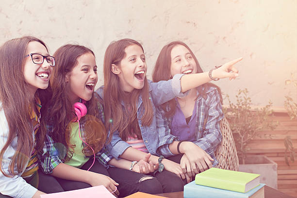 istock group of smiling pupils staying together and pointing up 509803778