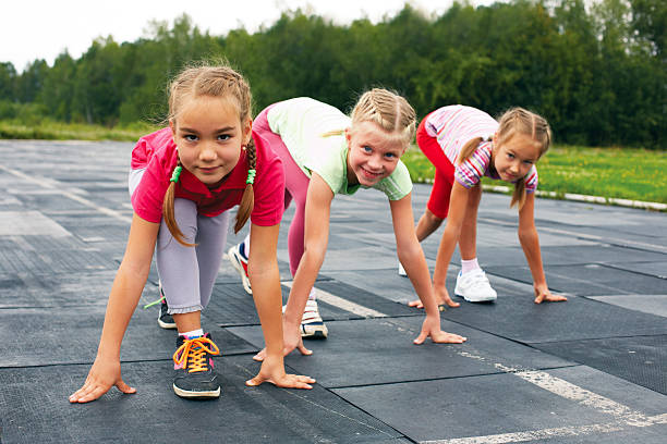 istock girls starting to run on track 509803851