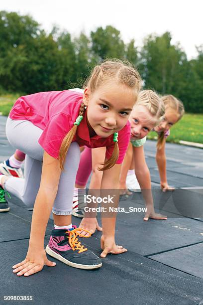 Three Schoolgirls Are At The Start On The Treadmill Stock Photo - Download Image Now