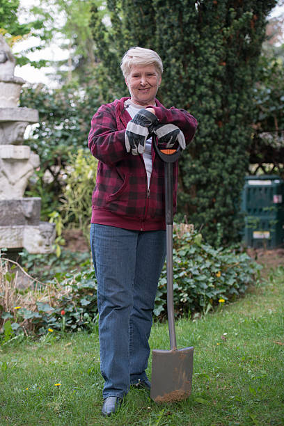 istock senior  woman gardening 509804862