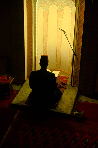 istock Man in mosque reading the Koran 509805012