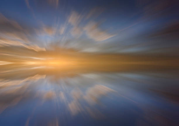 Reflection of clouds with long exposure effect, zoom blurred