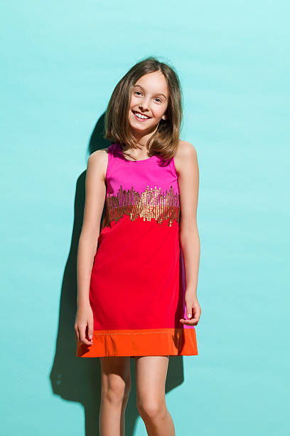 istock Cute little girl on a turquoise background 509806201