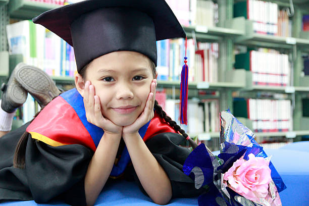 istock Girl in large graduation cap 509807986