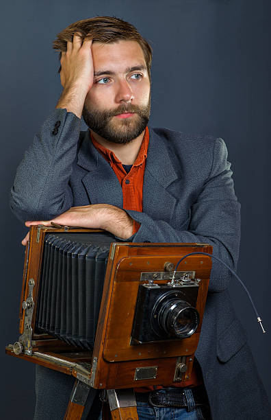 istock photographer with an old camera 509808605