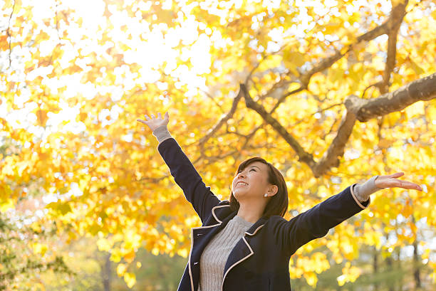 istock Asian woman and Autumn Leaves 509809568