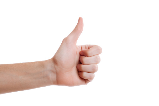 Shot of hand making thumb up gesture on white background. Voting hand