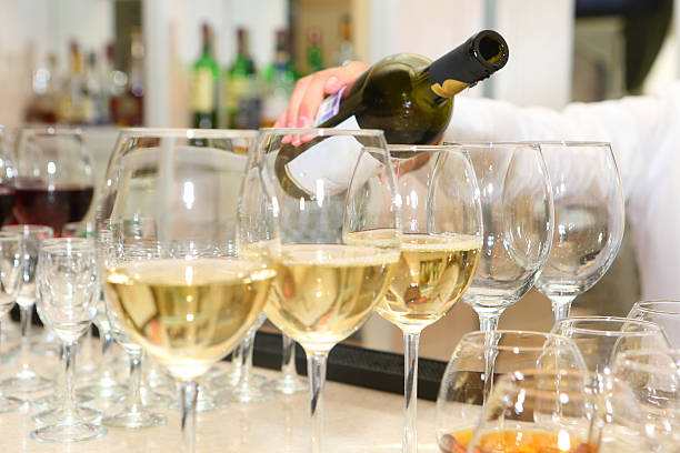 istock The waiter pours wine into glasses 509814668