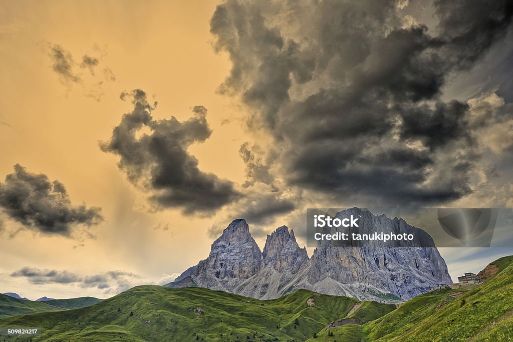 Sassolungo Mountain, Sassolungo Dramatic sunset over the Langkofel mountain. Dolomites. Province of Trento. Trentino-Alto Adige. Italy. Alto Adige - Italy Stock Photo