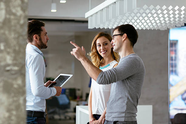 istock Coworkers talking in a office corridor. 509824447