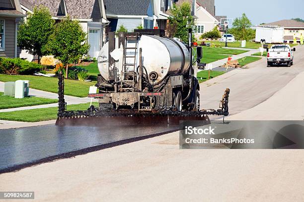 Seal Coating For Chip Sealing Asphalt Pavement Street Stock Photo - Download Image Now