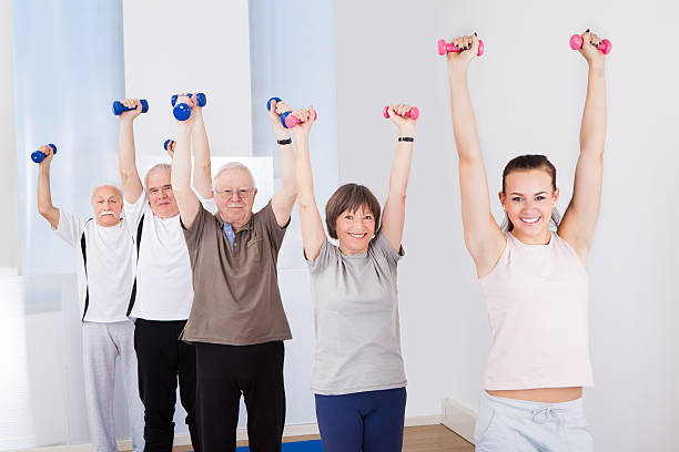 istock People Lifting Dumbbells At Gym 509827293