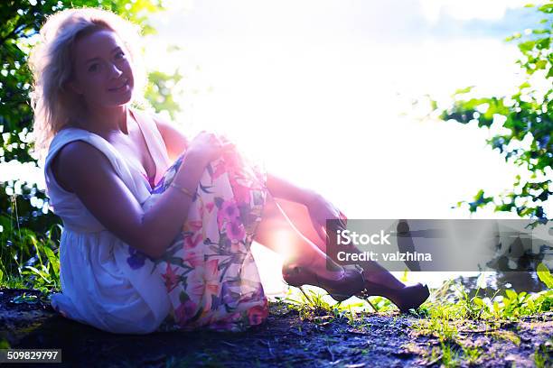 Portrait Of Beautiful Blond Woman Enjoying Warm Summer Sunset Stock Photo - Download Image Now