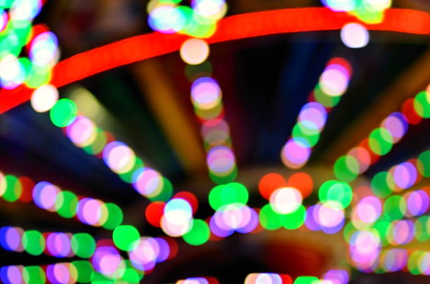 istock Abstract amusement park lights bokeh defocused abstract background 509829855