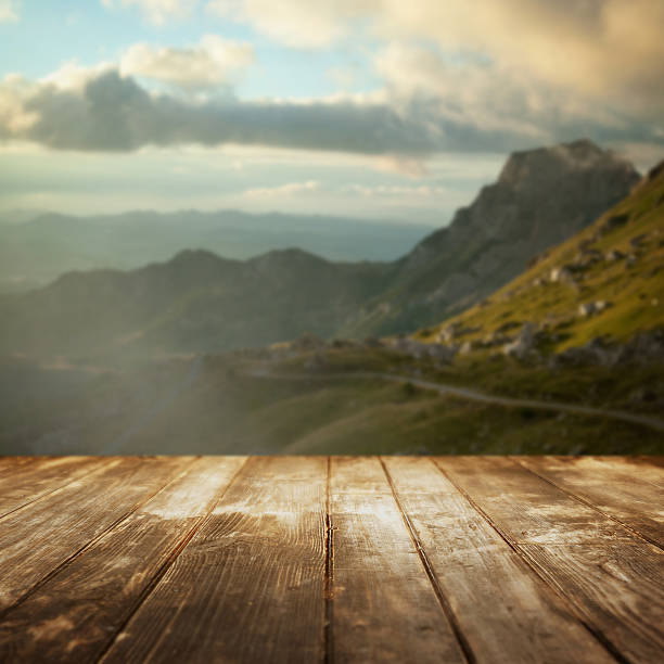 istock Wooden floor and defocused mountain valley on background. 509844852