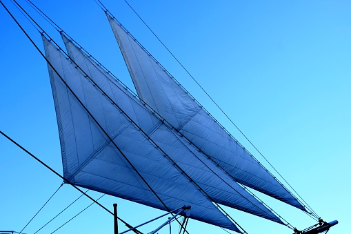 It is sail shining in a blue sky