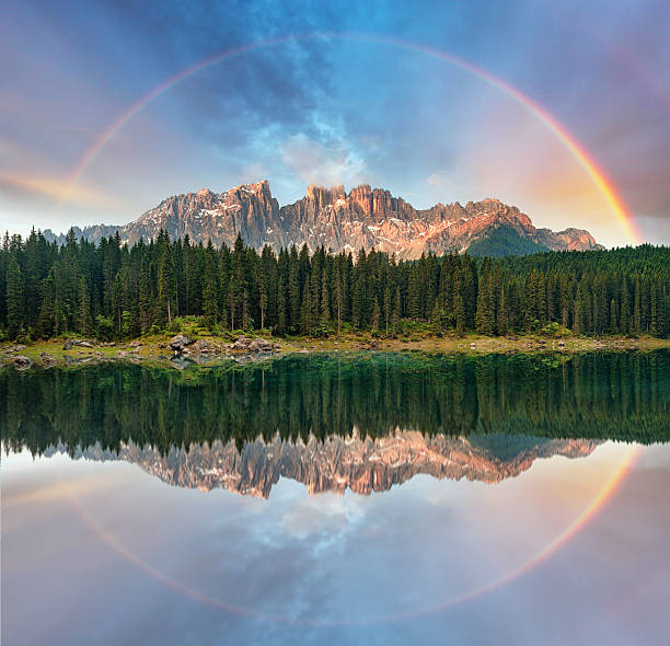 lago alpino con arcobaleno-lago di di carezza, italia - latemar mountain range foto e immagini stock