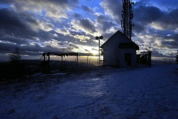 sunset on winter Ochodzita hill above Koniakow village in Beskid Slaski mountains in Poland