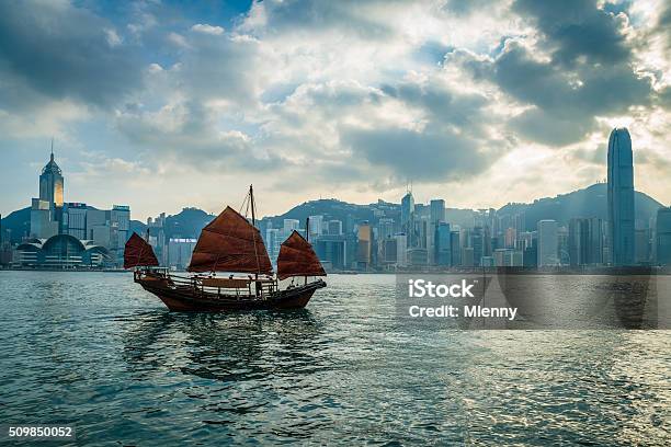 Hk Junkboat Sailing Along Hong Kong Skyline Stock Photo - Download Image Now - Hong Kong, Ferry, Harbor