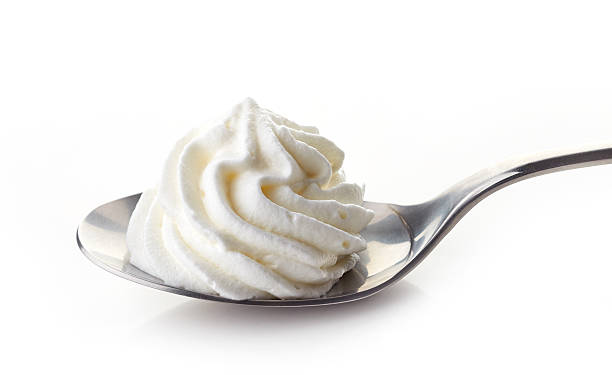 istock spoon of whipped cream 509850728