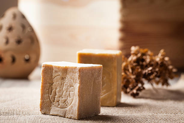 Olive oil soap from Aleppo, canvas, wooden background.