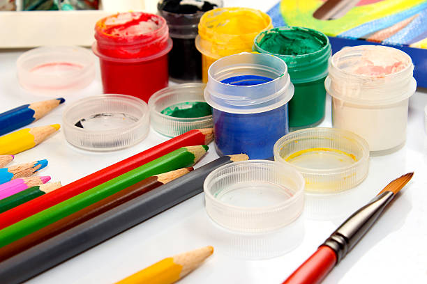 istock Paints and pencils on white background 509853824