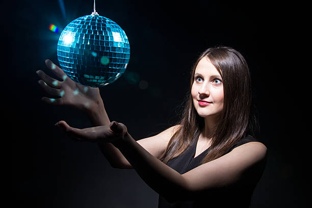 istock Woman touching disco ball 509855350