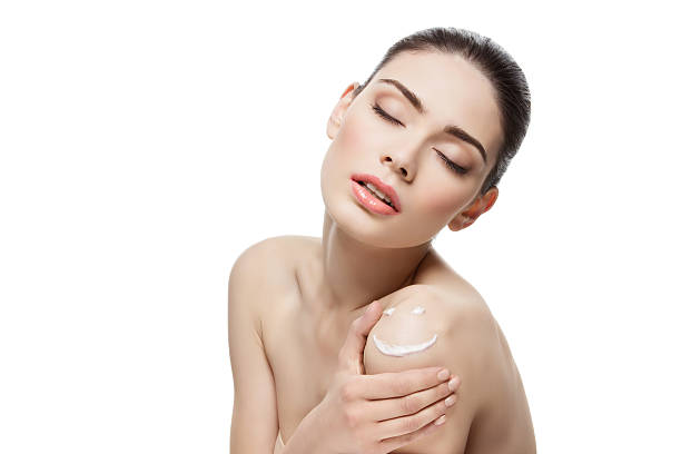istock Girl with cream smiley face on shoulder 509856638