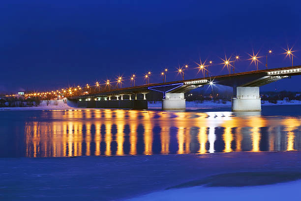 istock Bridge with lanterns and reflection in water of river 509857312