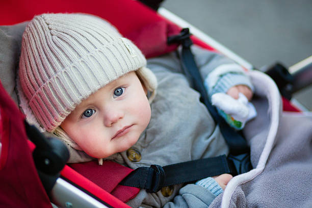 istock 9 month little boy with blue eyes in a stroller 509857528