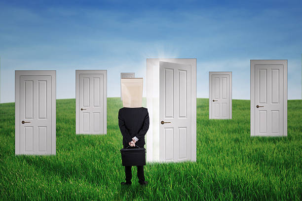 istock Anonymous businessman and the doors of chance 509859057