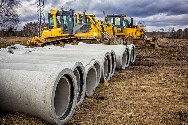 Concrete drainage pipes and bulldozers on the construction of a new highway S3, Lubuskie province, Poland 