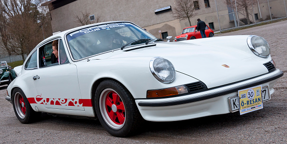 Stockholm, Sweden - April 21,2012: A fully restored Porsche 911 E from 1973, in a classic car cavalcade around the small island Lidingö in Stockholm Sweden.