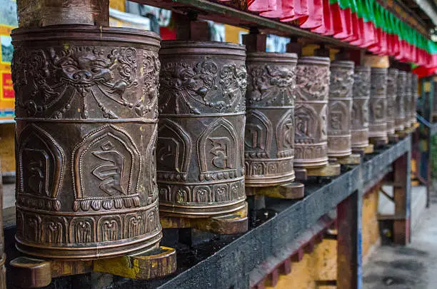 Prayer wheels at the entrance of Potala Palace, former residence of Dalai Lama