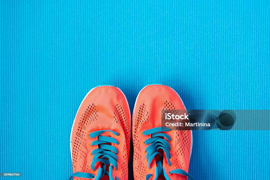 Sport and fitness lifestyle concept background Fitness and gym workout concept. Healthy lifestyle background with sport training shoes close up and blue copy space. Blue Stock Photo