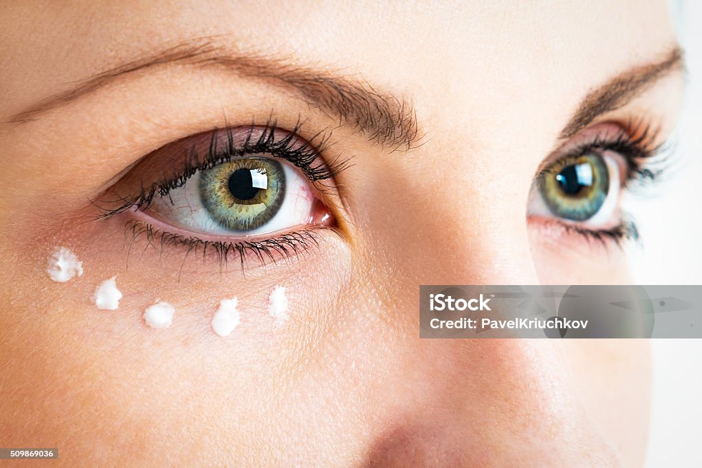 Caring for the skin around the eyes Caring for the skin around the eyes. Photo closeup. Eye Stock Photo
