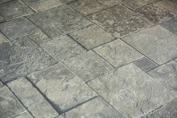 istock Background texture of gray tiled pavement city ground 509870430