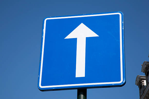 istock Blue and White Arrow Sign on Sky Background 509870714